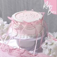 YGDZ pink satin bows decorate cupcakes for a stylish dessert table
