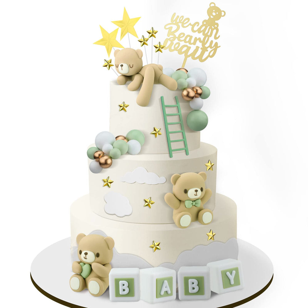 Yinder bear cake topper with green bow adds a charming touch to celebrations.