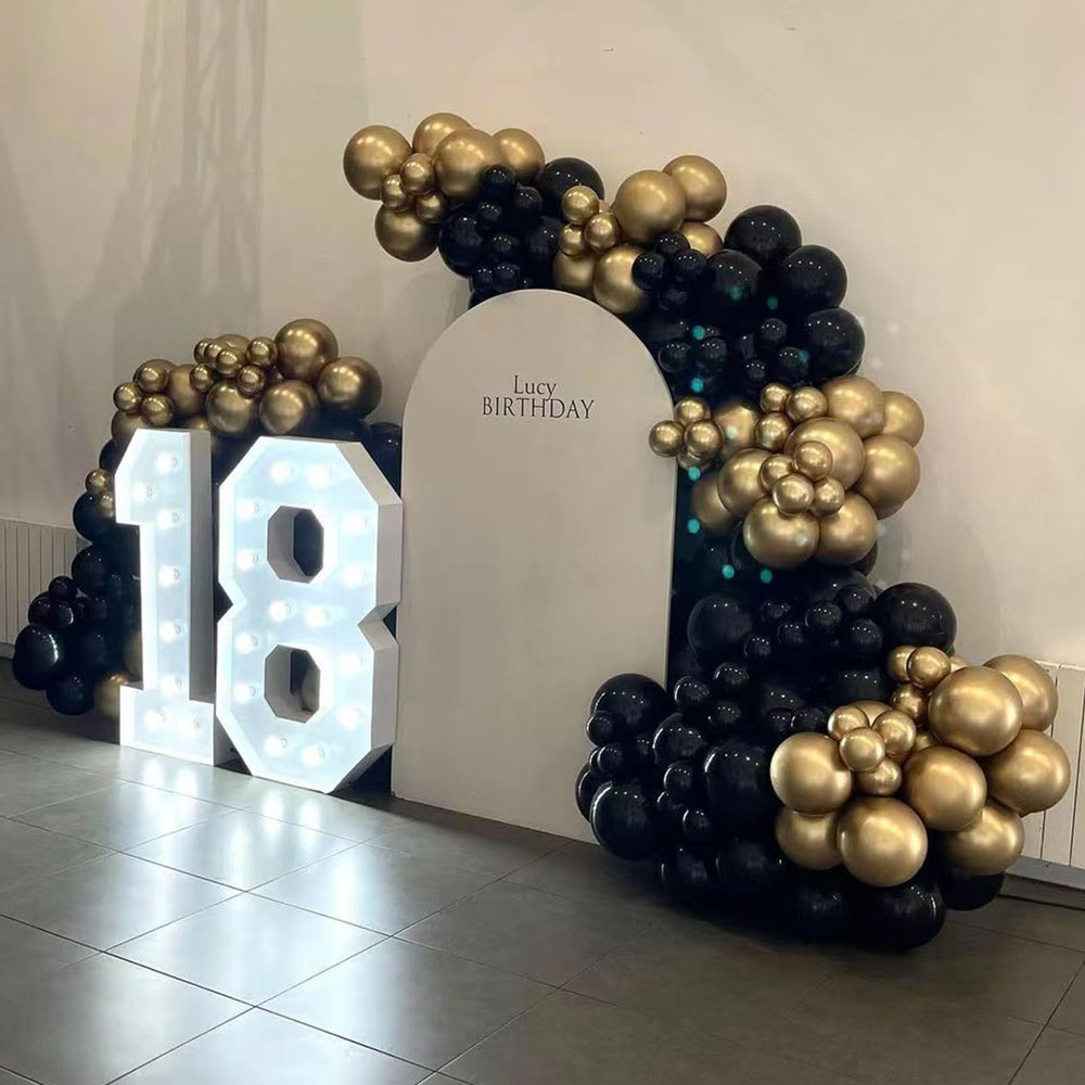 YMSZ 12-inch gold balloon complements arch design.