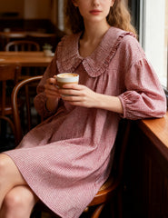 Ynhonra 2025 plaid mini dress on model with 3/4 puff sleeves, casual styling option.