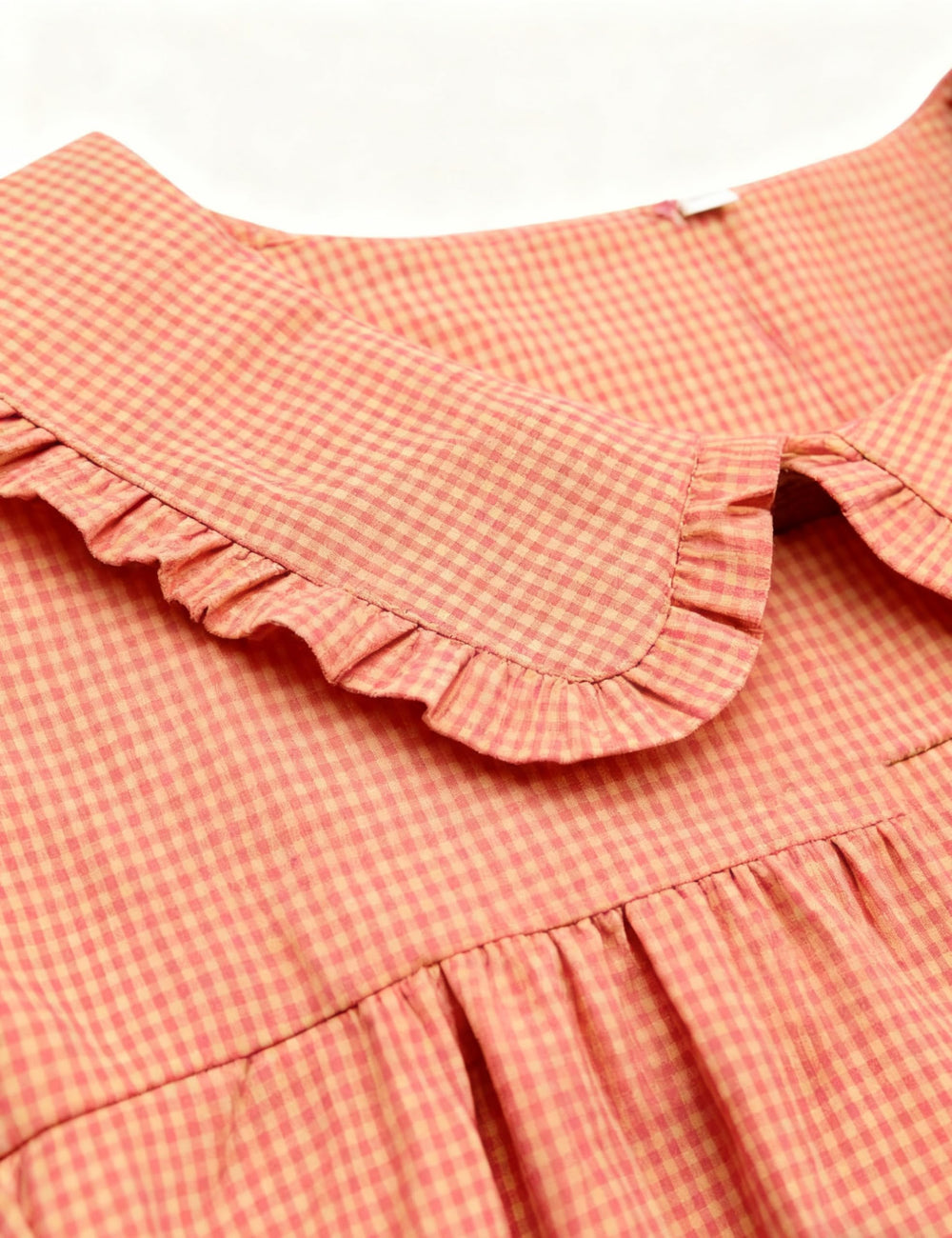 Ynhonra NeonPink doll collar detail adds playful versatile appeal.