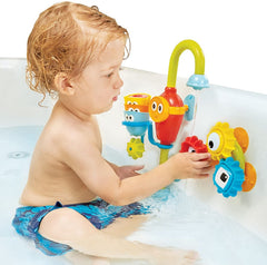 Yookidoo hose and spout connected to tub for splashy water flow and pouring fun.