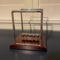 Yoqanr Newton's Cradle stress-relief motion fosters calm at work