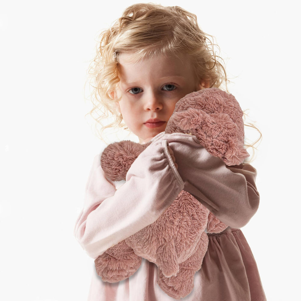 YOUBLEK plush toy in a cozy home decor setting.