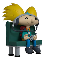 Youtooz Arnold vinyl figure in plaid shirt and blue pants creates dynamic window display.