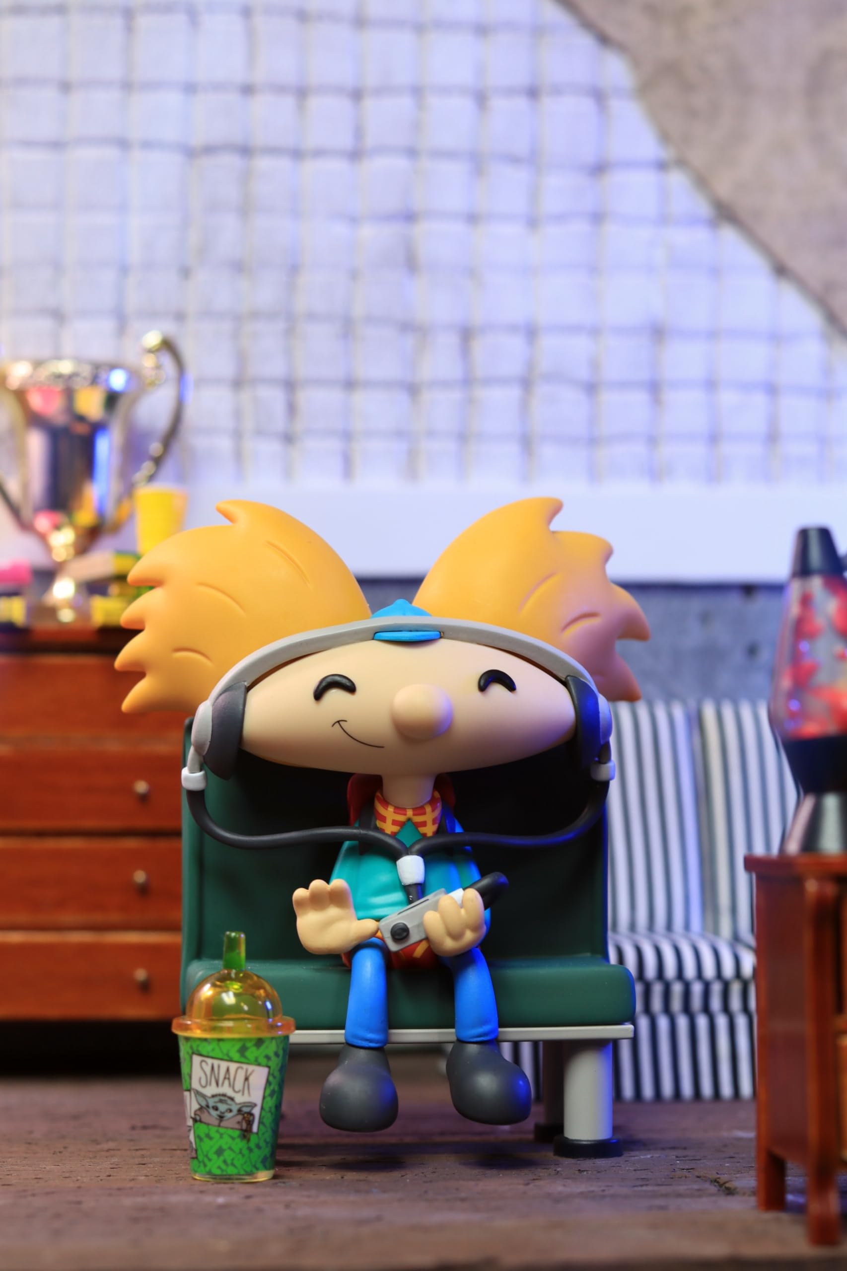 Youtooz Arnold vinyl figure with yellow hair evokes retro style for collectibles display.