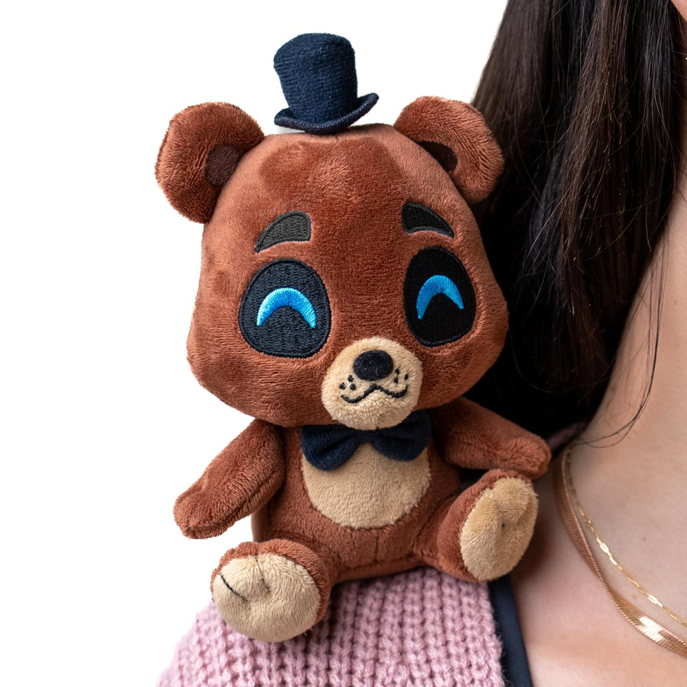 Top hat and ears emphasize Freddy's iconic look for shelf or cosplay.