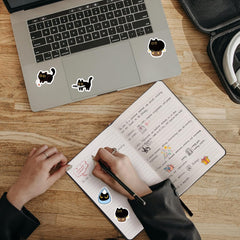 Yuanqichuanglian black cat stickers on a tablet for portable, fun customization