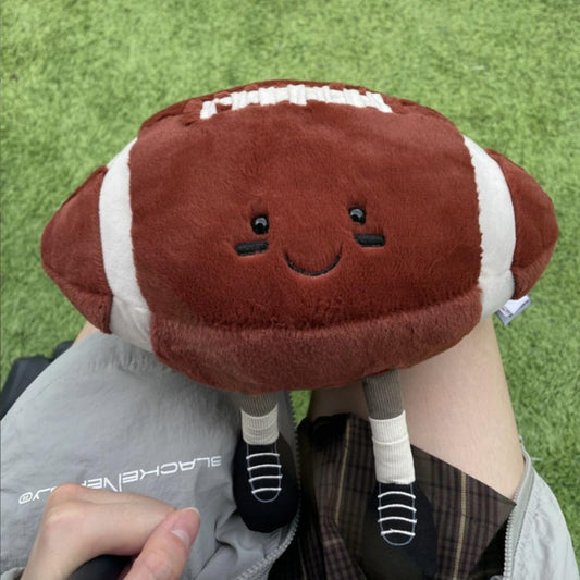YUDONG football plush pillow fabric close-up shows soft material and durability.
