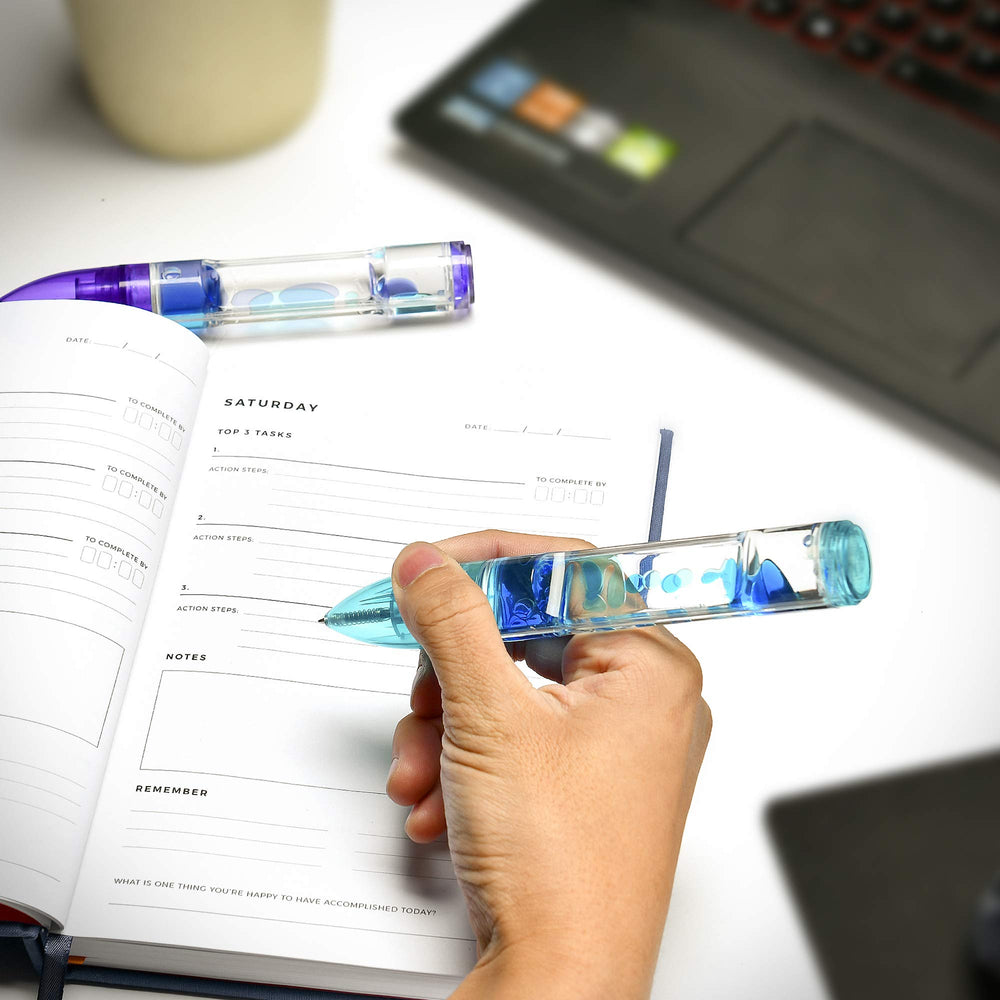 Red lava pen swirl supports sensory focus while drafting notes.
