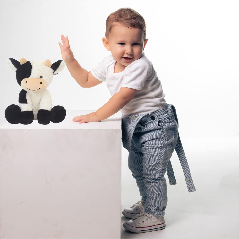 YUKOUQIAN cow plush fabric closeup highlighting soft material for bedtime.