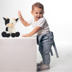 YUKOUQIAN cow plush fabric closeup highlighting soft material for bedtime.