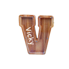 YWMSGM personalized wooden piggy bank showing letter selection for names