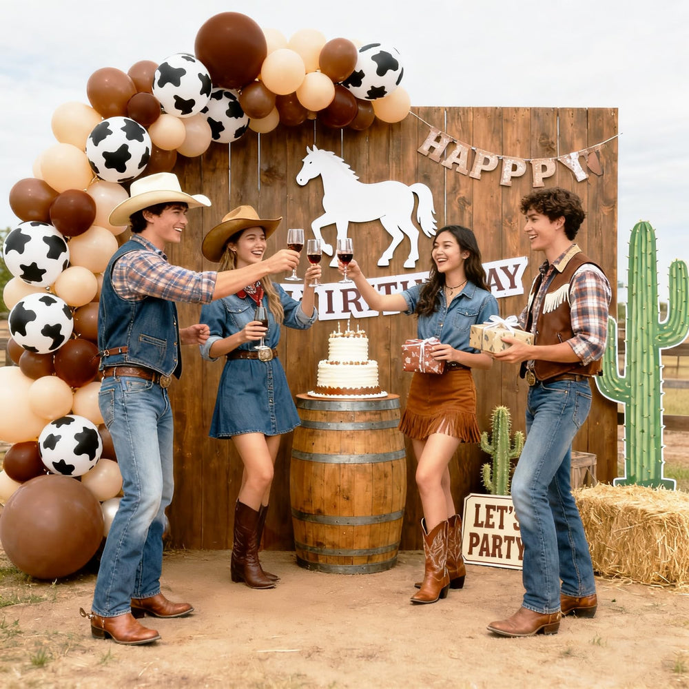 YYDTMHT arch decor ready as a backdrop for Western party photos.