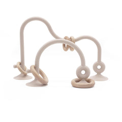 zeeloopbee high chair toy with suction cups secures play on beige surface