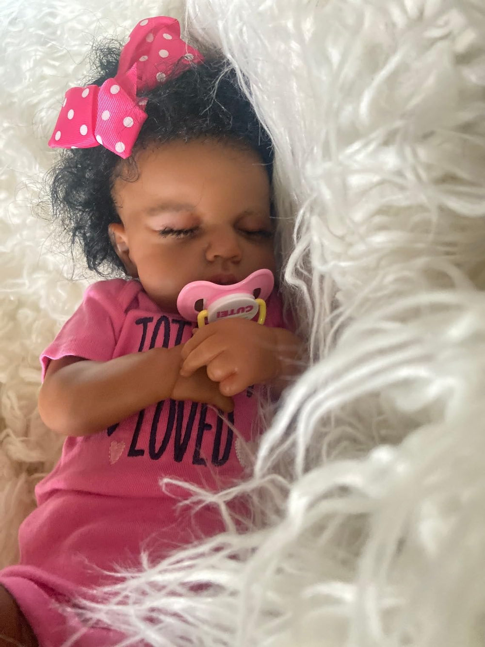 Zero Pam Black Reborn Doll packaging includes birth certificate and outfit.