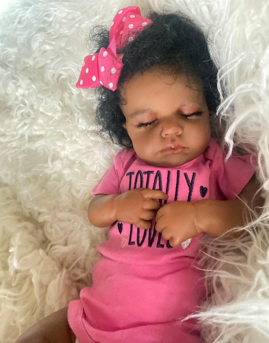 Zero Pam 20-inch Black Reborn Doll profile view highlights flexible limbs.