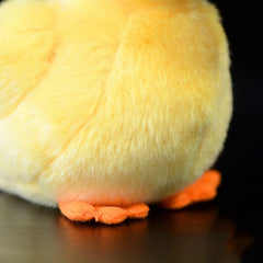 ZHONGXIN MADE Yellow Little Duck Plush decorates a cozy child's room.