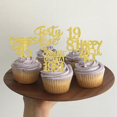 ZHUOWEISM cheers to 45 years cupcake picks highlight celebratory dessert decor.
