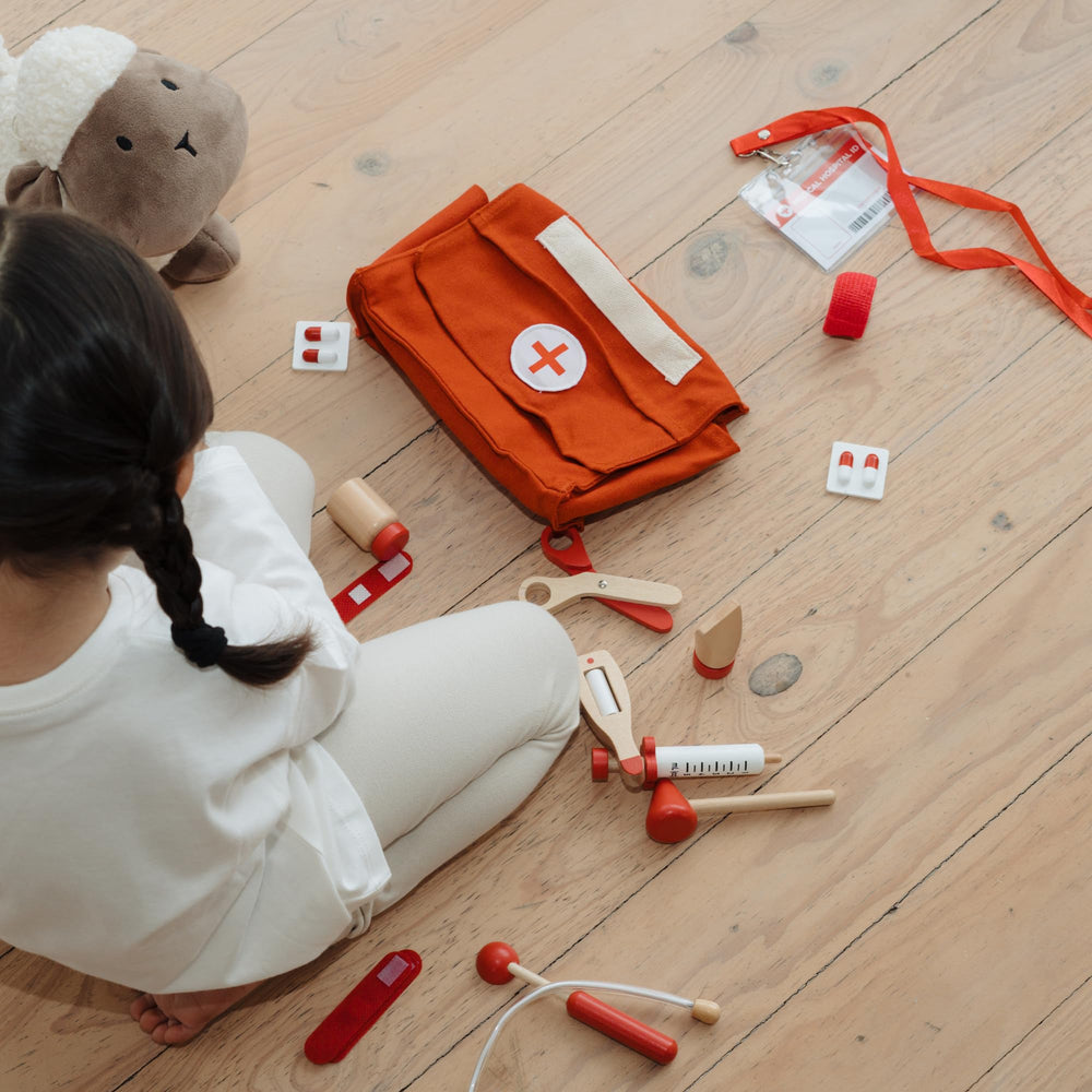 ZICOTO child engaging in imaginative doctor play to develop social skills.