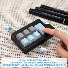 Zioyihan Keyboard Fidget Clicker black-blue on a workspace with vivid color clash.
