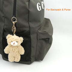 Zitokin bear plush keychain with brown fur and purple heart, perfect backpack charm.